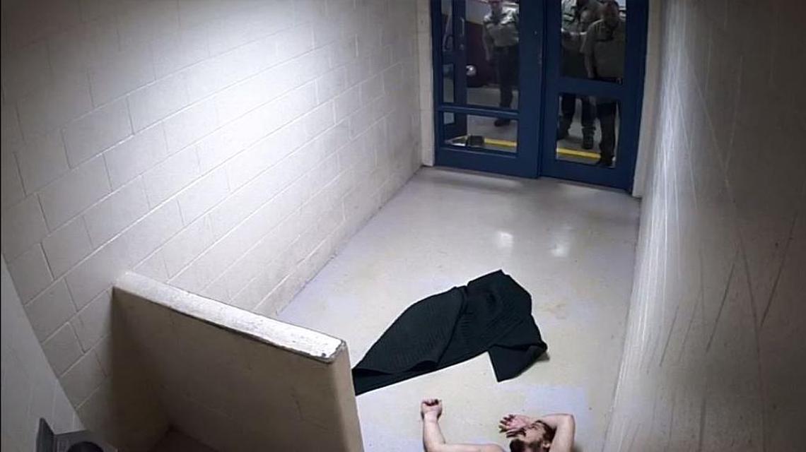 Atascadero resident Andrew Holland, 36, at the moment he appears to lose consciousness while Sheriff’s deputies look on in the San Luis Obispo County Jail on Jan. 22, 2017.