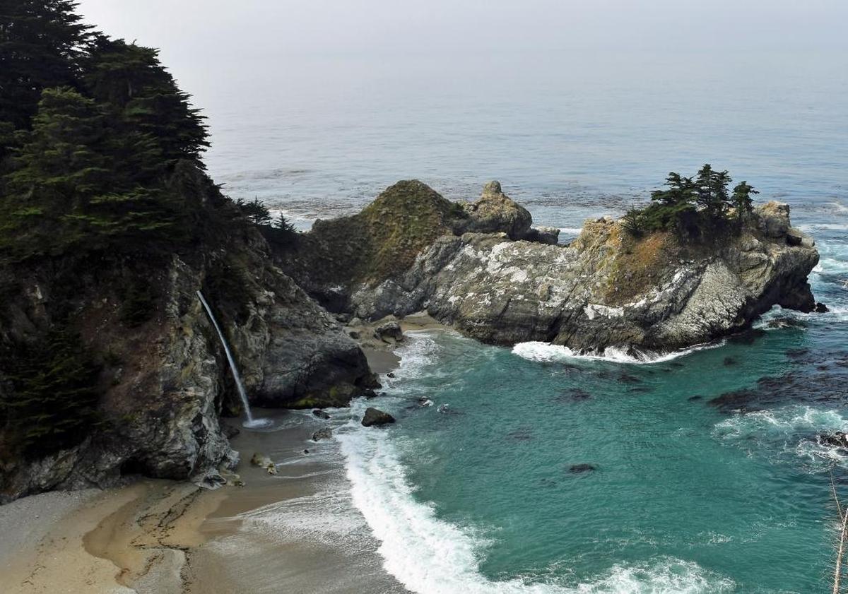 Julia Pfeiffer Burns State Park is home to McWay Falls, an 80-foot waterfall that flows from McWay Creek into the Pacific Ocean.