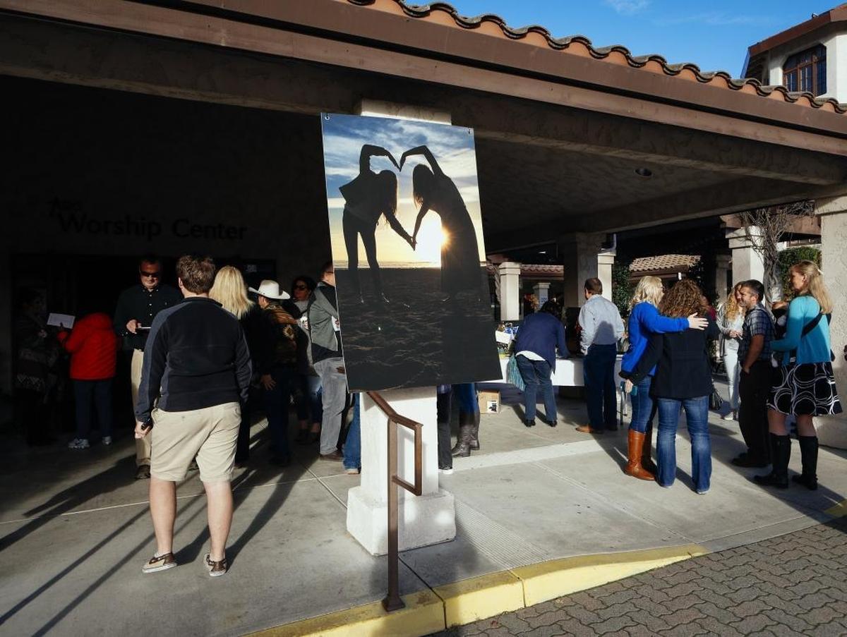 Friends and family arrive for the celebration of life service for Brynn and Brittni Frace on Friday at Atascadero Bible Church.