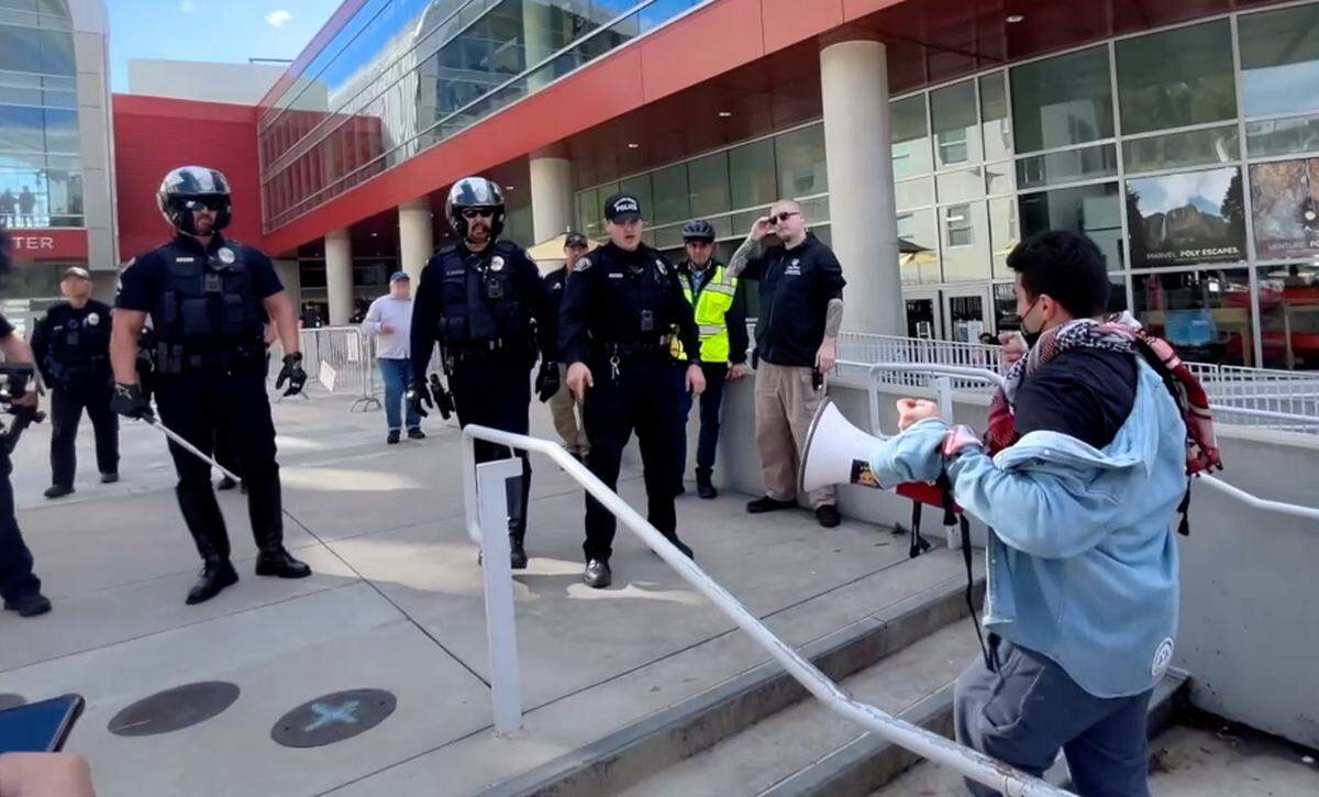 Cal Poly student Samir Ibrahim yells at officers outside the Cal Poly Rec Center after they told pro-Palestine protesters to leave following a clash between police and pro-Palestine demonstrators on Tuesday, Jan. 23, 2024.