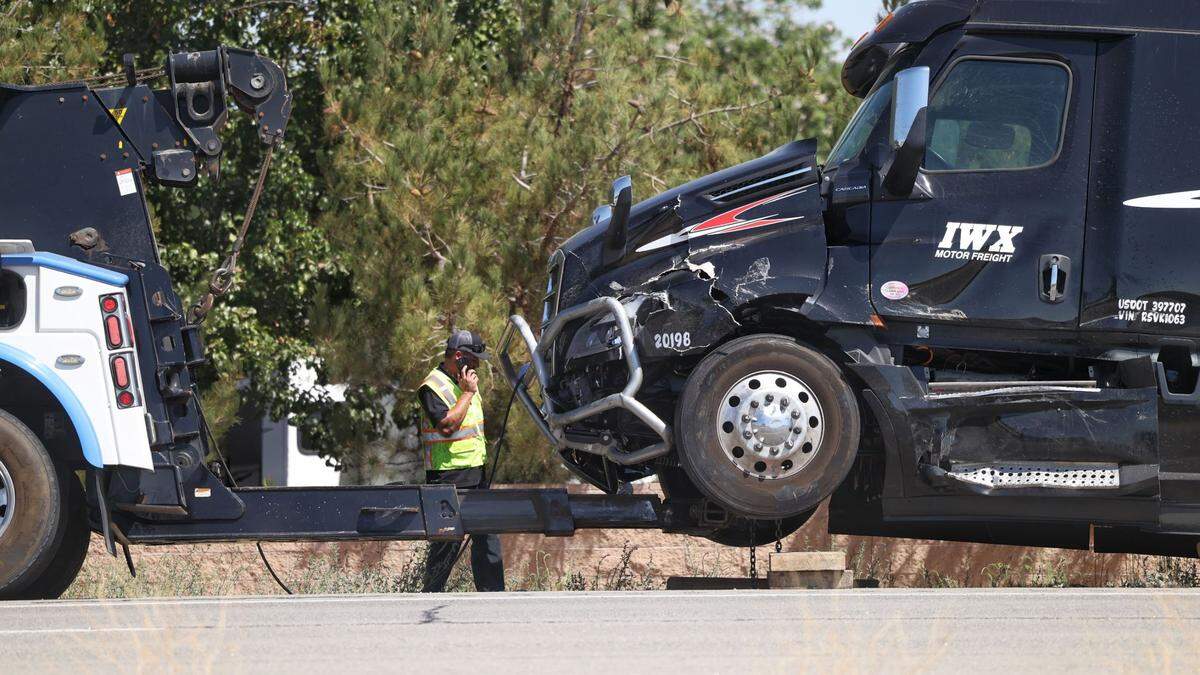 A damaged big rig is towed from the Wellsona Road intersection with Highway 101 after a fatal collision with an SUV on Wednesday, Aug. 28, 2024.
