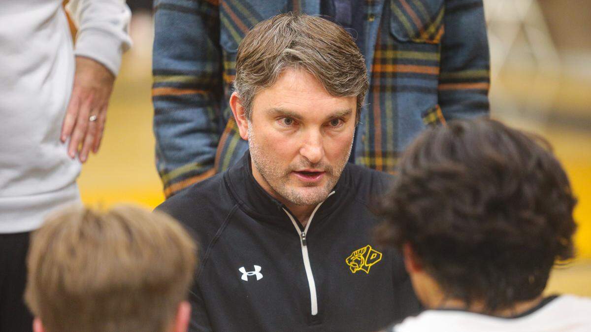 San Luis Obispo High School boys basketball Coach Jeff Brandow talks to the team during a game on Jan. 20, 2023. Brandow was fired in August 2023 following sexual harassment allegations from a student.