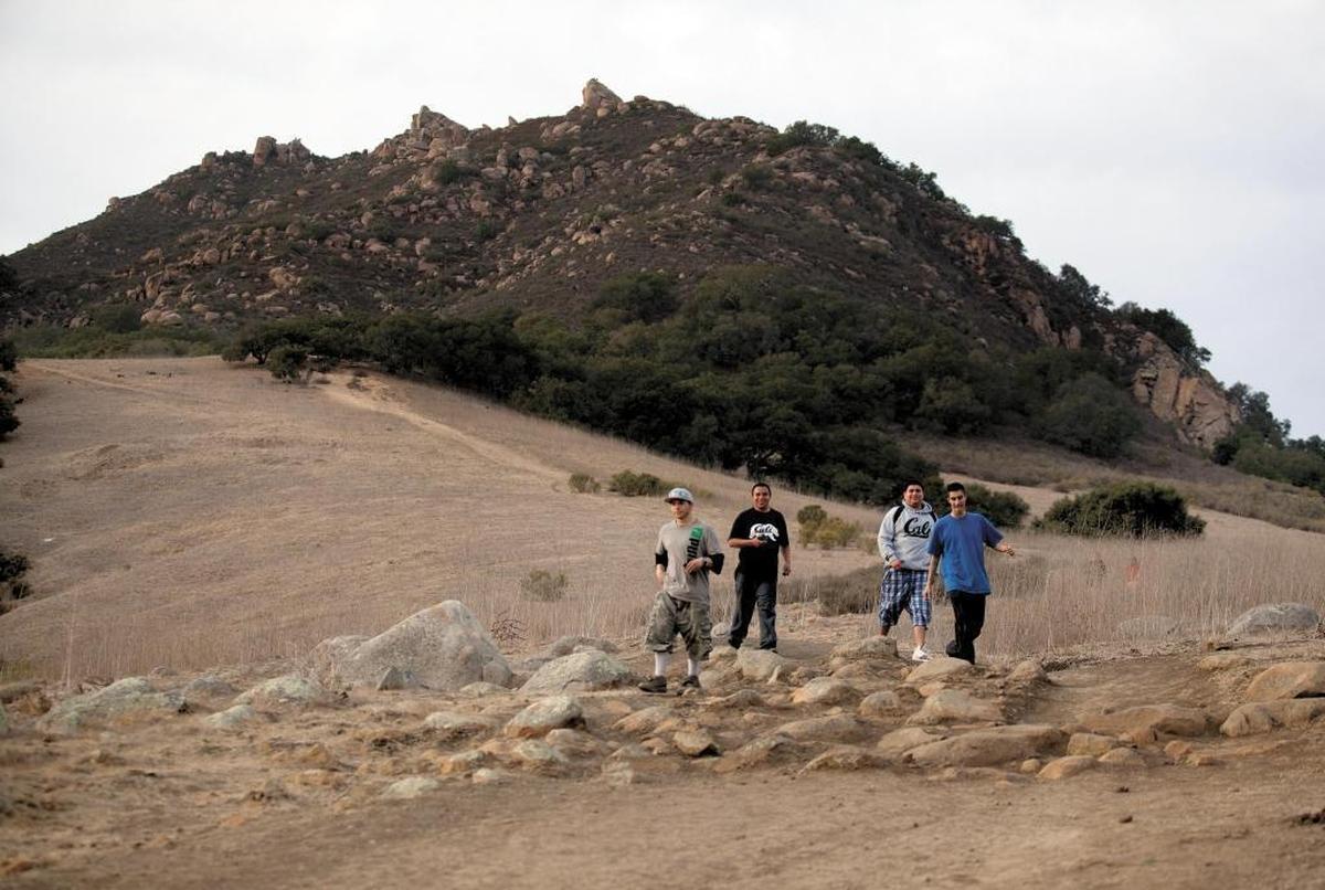 Hiking down from Bishop Peak on a chilly Saturday afternoon are, from left, Cristian Beltran, Jose Hernandez, Sebastian Ramirez and Ramon Yanez, all are from Paso Robles.