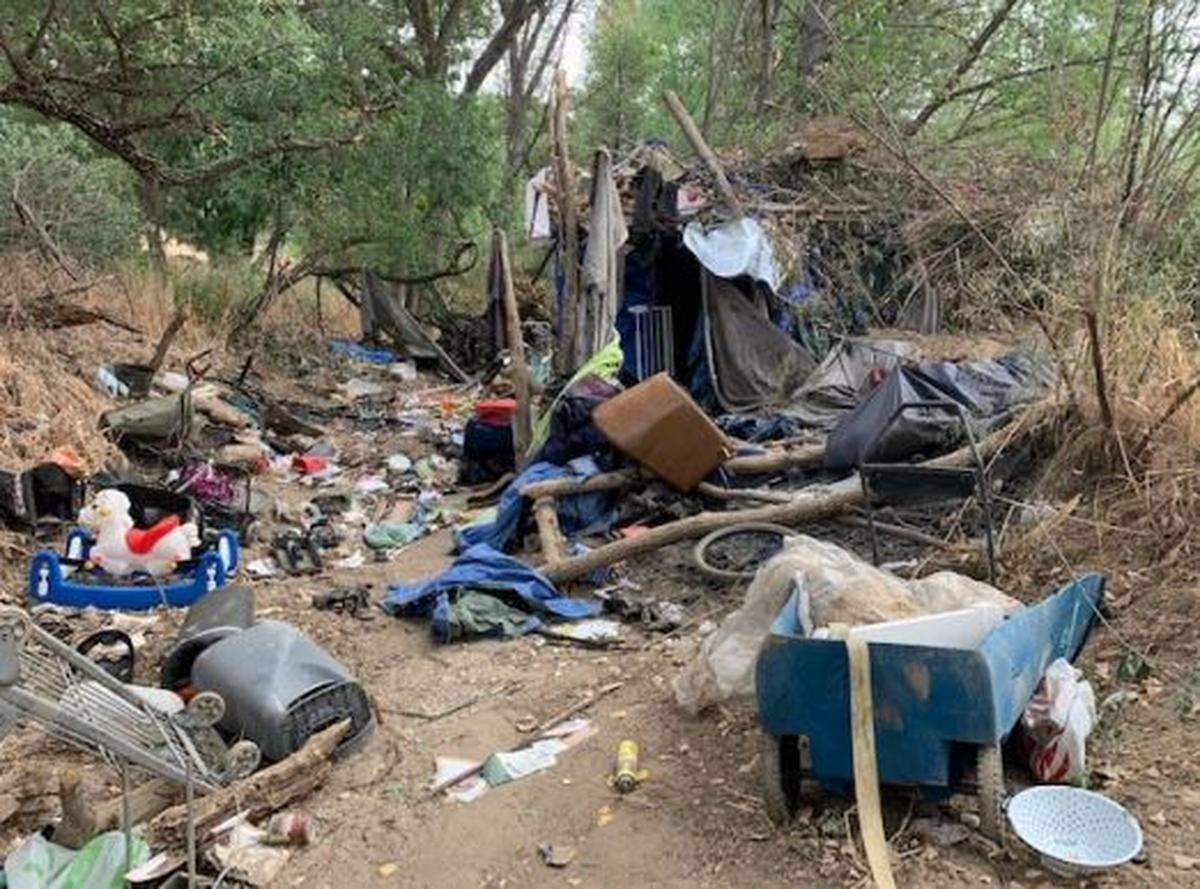 Clothes, personal items, tents and garbage are scattered around homeless encampments in the Salinas Riverbed. The City Council plans to clean up camps in the riverbed and construct a temporary shelter for homeless residents.