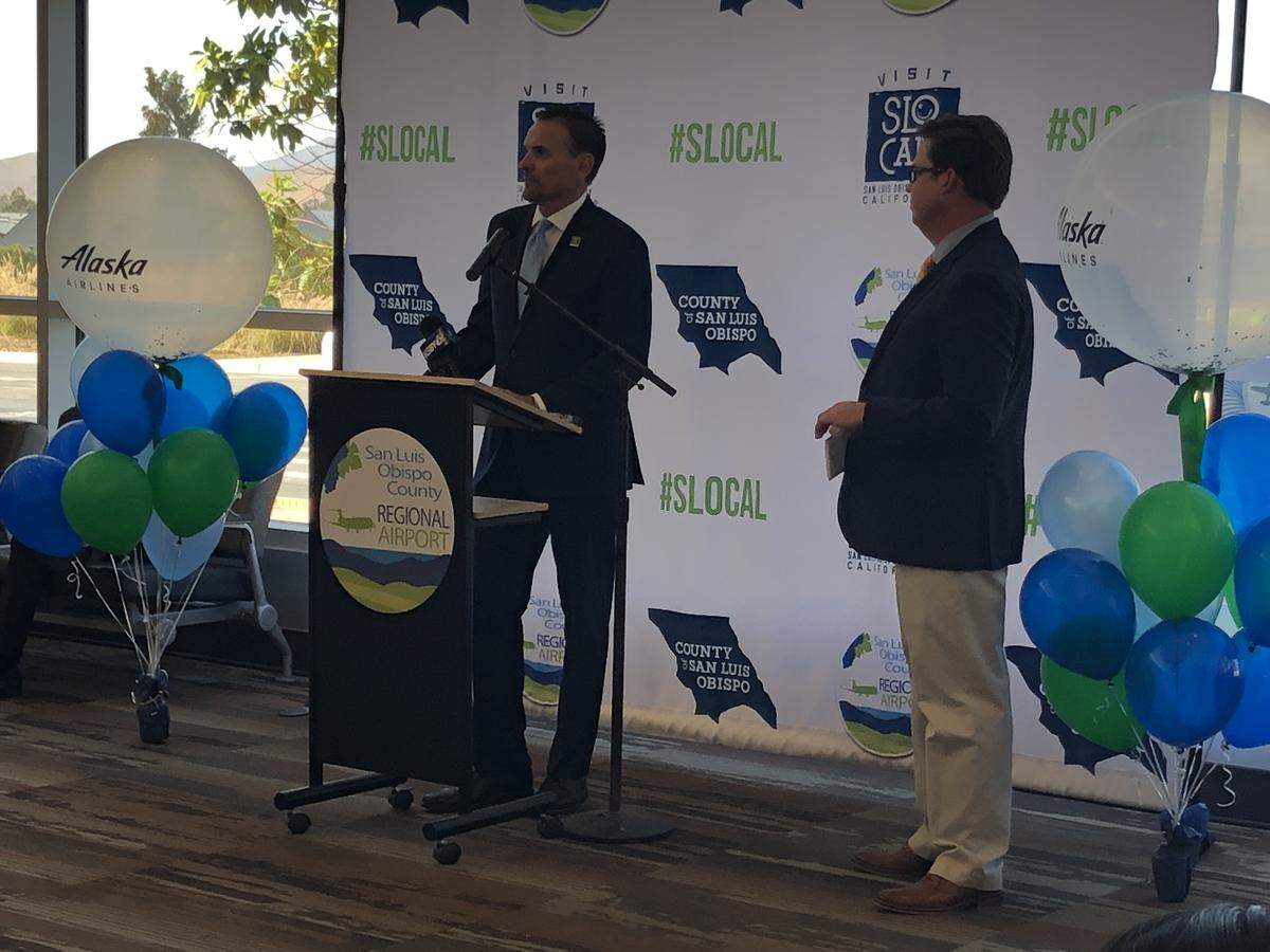 Chuck Davison of Visit SLO CAL and Kevin Bumen, county director of airports, announce the two new Alaska Airlines flights to Portland and San Diego.