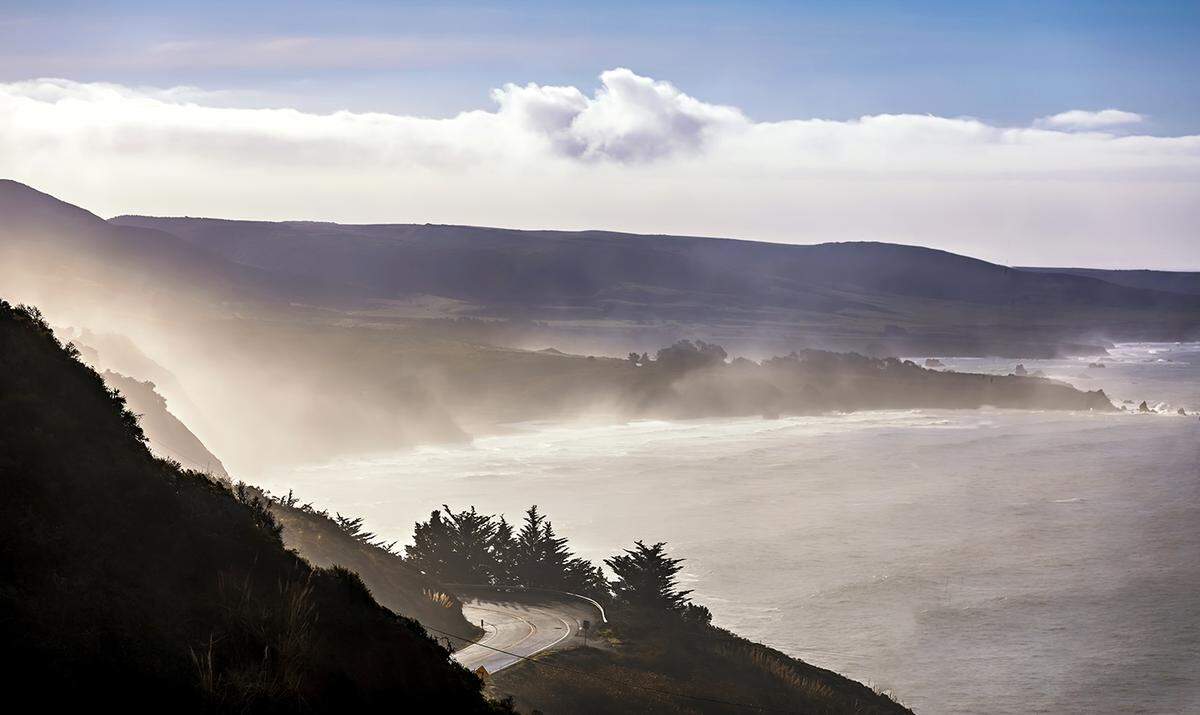 Highway 1 winds along the misty Big Sur coast.