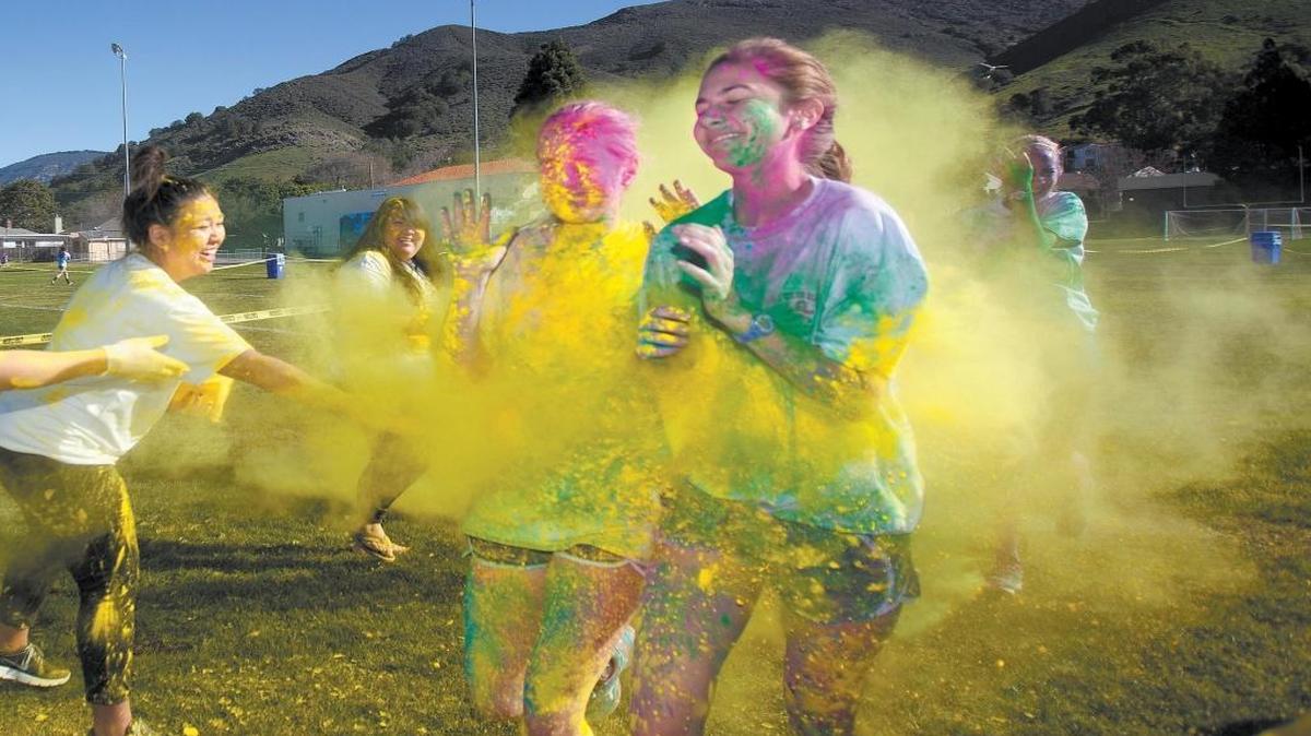 The SLO Color Blast Fun Run participants get blasted with yellow dye during the 2015 fundraiser.