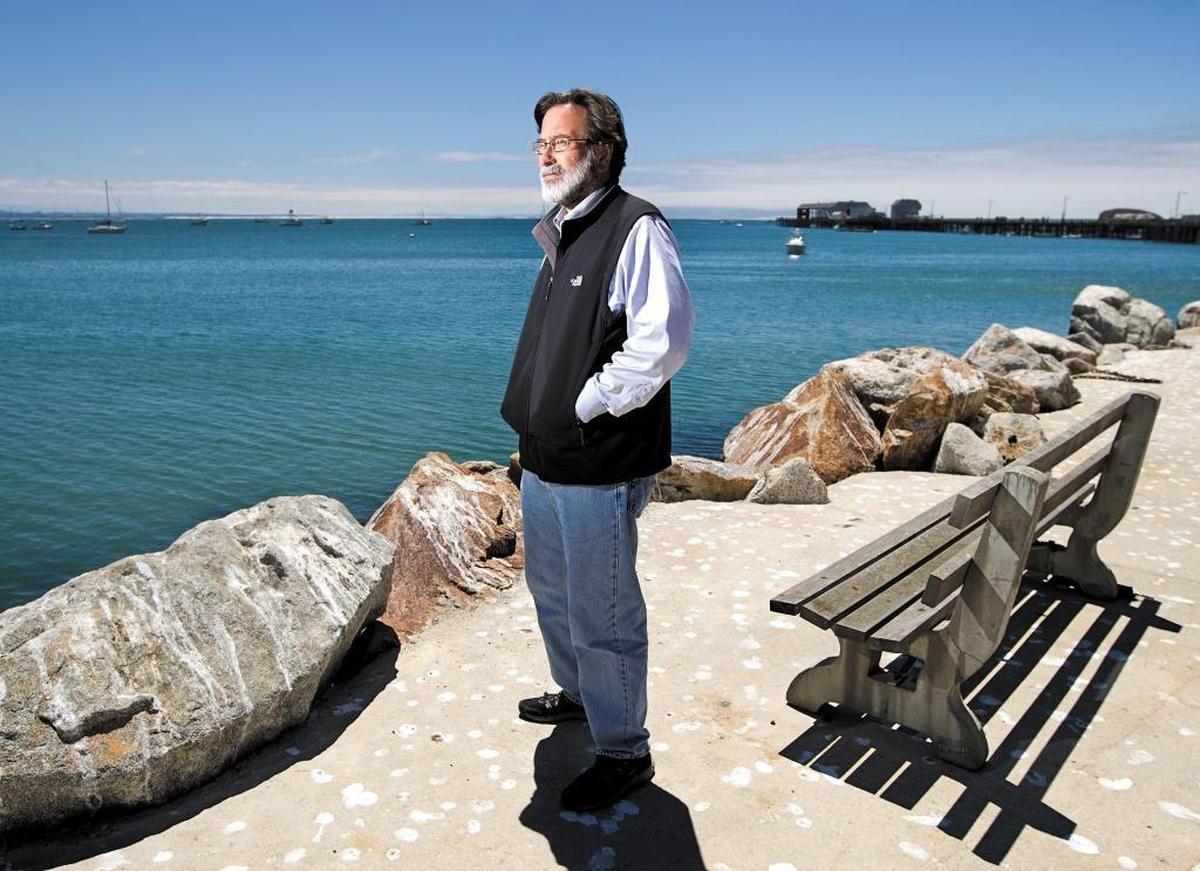 File photo: Richard Martinez, father of Christopher Michael-Martinez, who was killed in the violent rampage near UCSB in May 2014, looks out across the water at Port San Luis, a place he and his son loved to visit together.