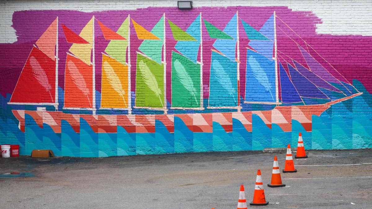 A wrap-around mural on the back of the Fremont Theatre and Woodstock’s Pizza is the work of Boston-based artist Maria Molteni. It connects the Seven Sisters with the seven Pleiades. “If you’re looking at the picture, you can see there are the seven peaks that are being painted and then the ship on the Woodstock’s wall has seven sails, and that’s in reference to how the Pleaides star cluster was used for navigation on the ocean,” said Emma Saperstein, chief curator at the San Luis Obispo Museum of Art.