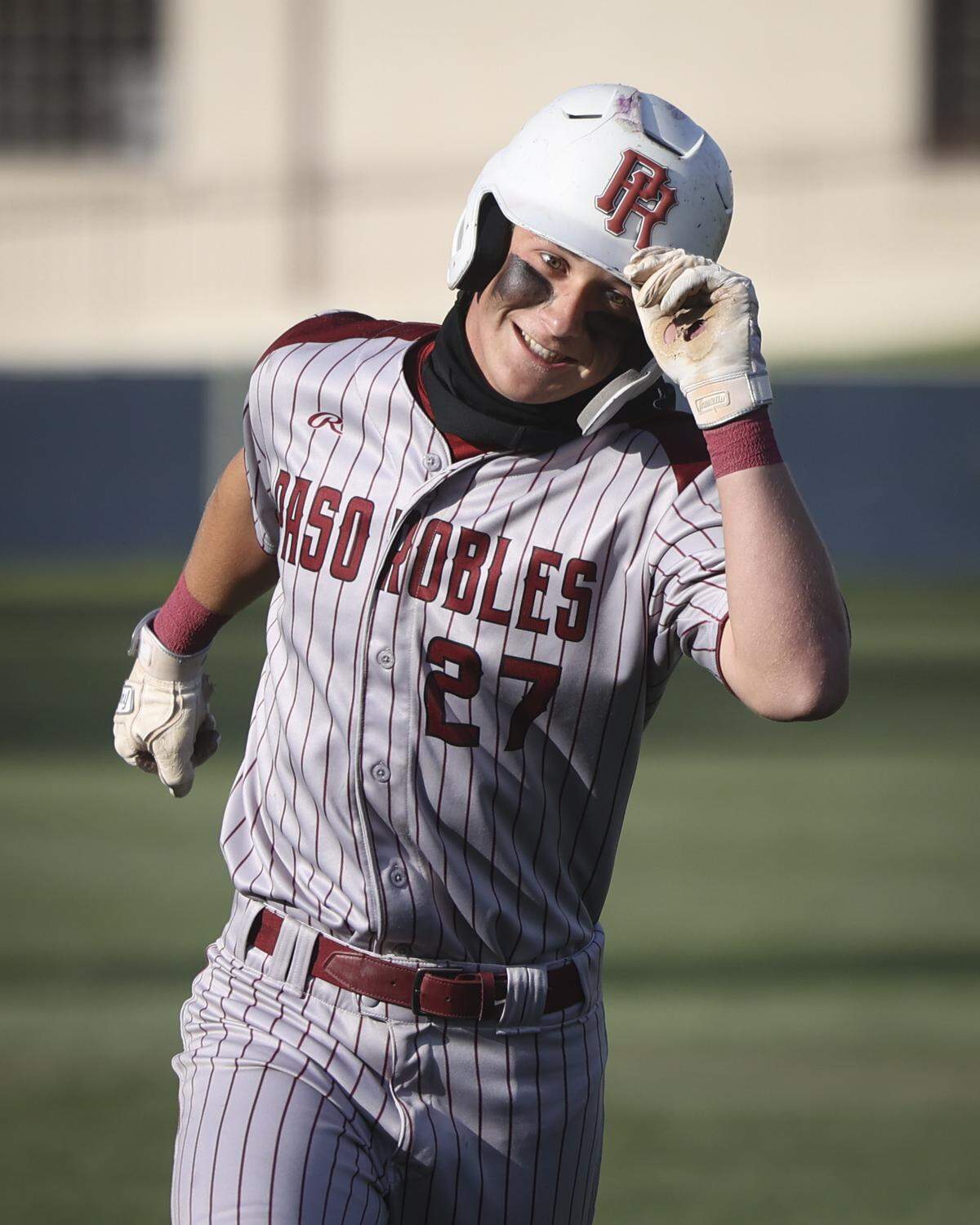 Blayne Lowry tips helmet rounding the bases after home run. Paso Robles beat Mission Prep 6-3 in a first round baseball playoff.