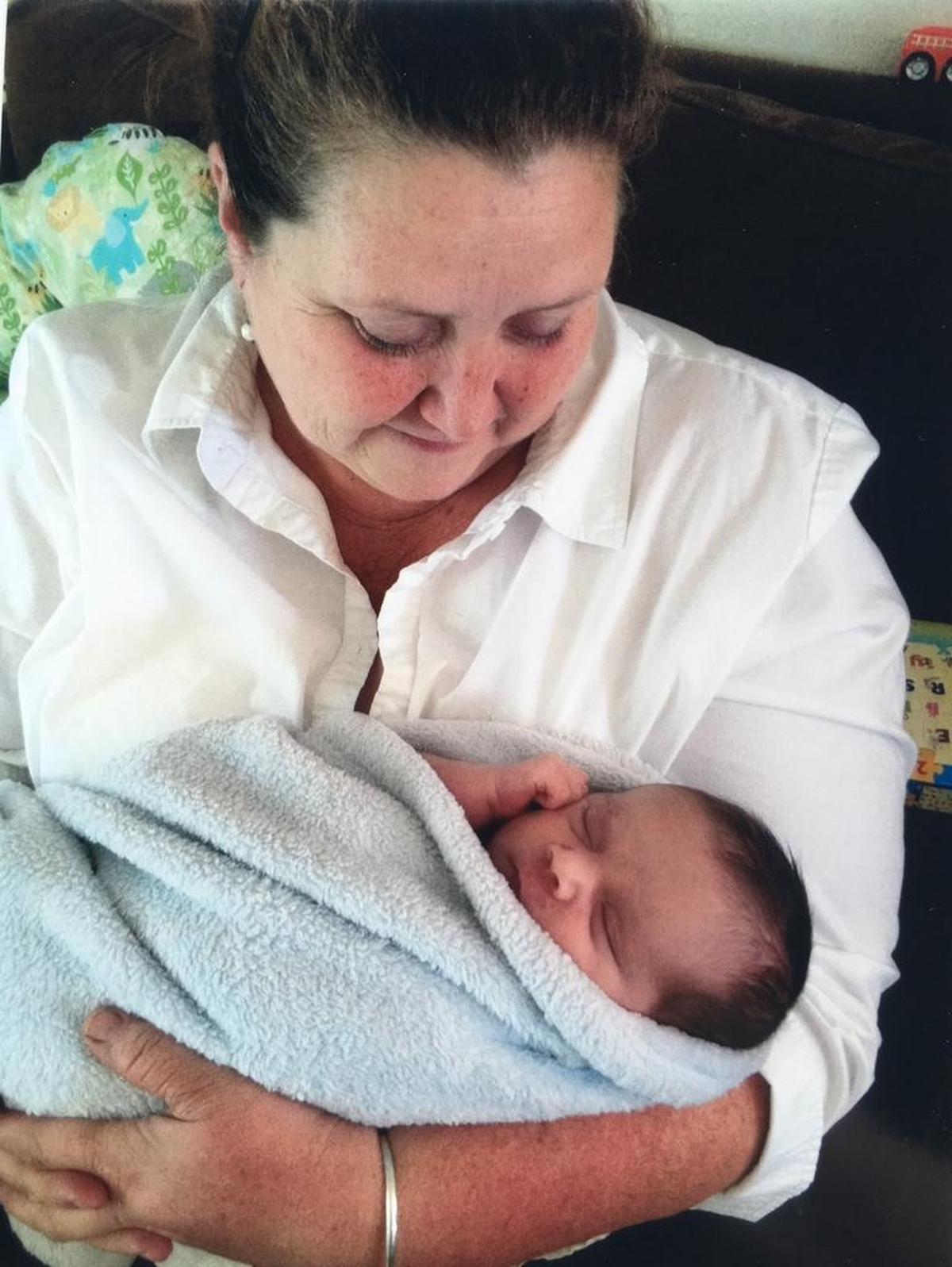 Denise Fox holds one of her grandsons. Fox was killed in a head-on collision near Pozo in 2016.