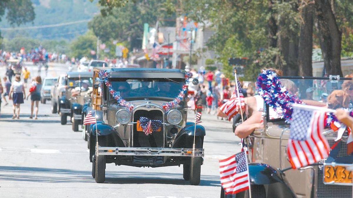 Members of the Ford Model A Club drive down Main Street in Templeton during a Fourth of July parade.