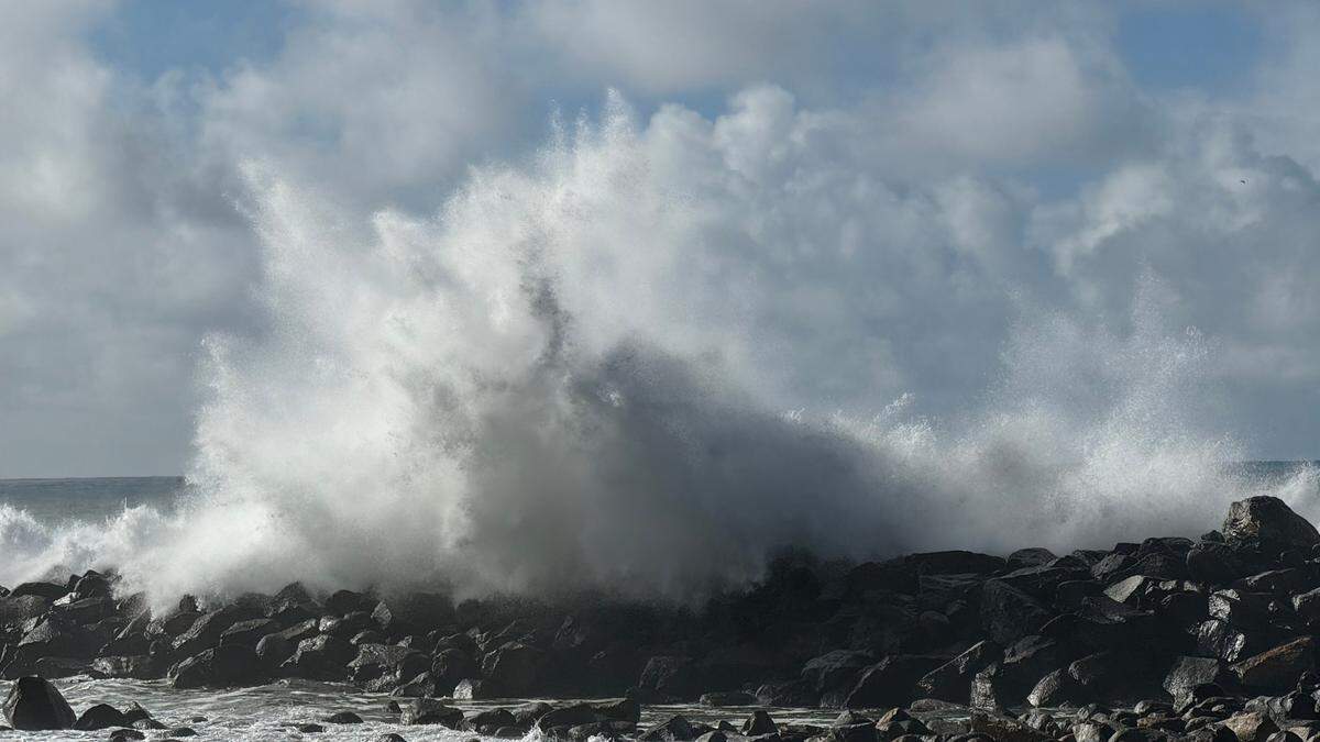 Powerful waves crash over the breakwater in Morro Bay on Saturday, Dec. 30, 2023.