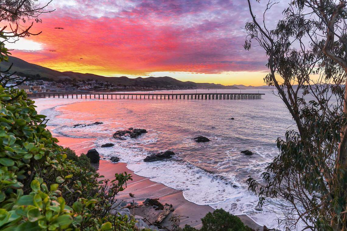 The sun rises Thursday, Feb. 22, 2024, over the damaged Cayucos Pier. Five pilings were knocked loose from the end of the pier in the recent storms. The pier has reopened, but the end will be fenced off until repairs can be completed, hopefully by the fall, the county said.