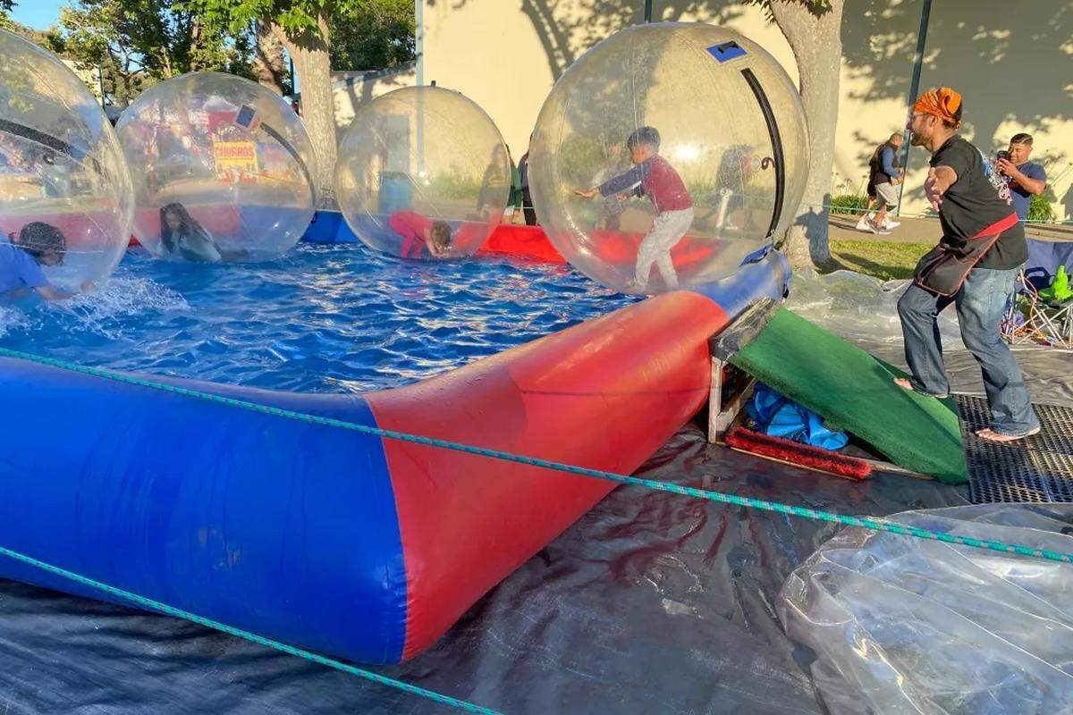 Santa Barbara County Fair-goers prove you can walk on water at an outdoor play area at the Santa Maria Fairpark.