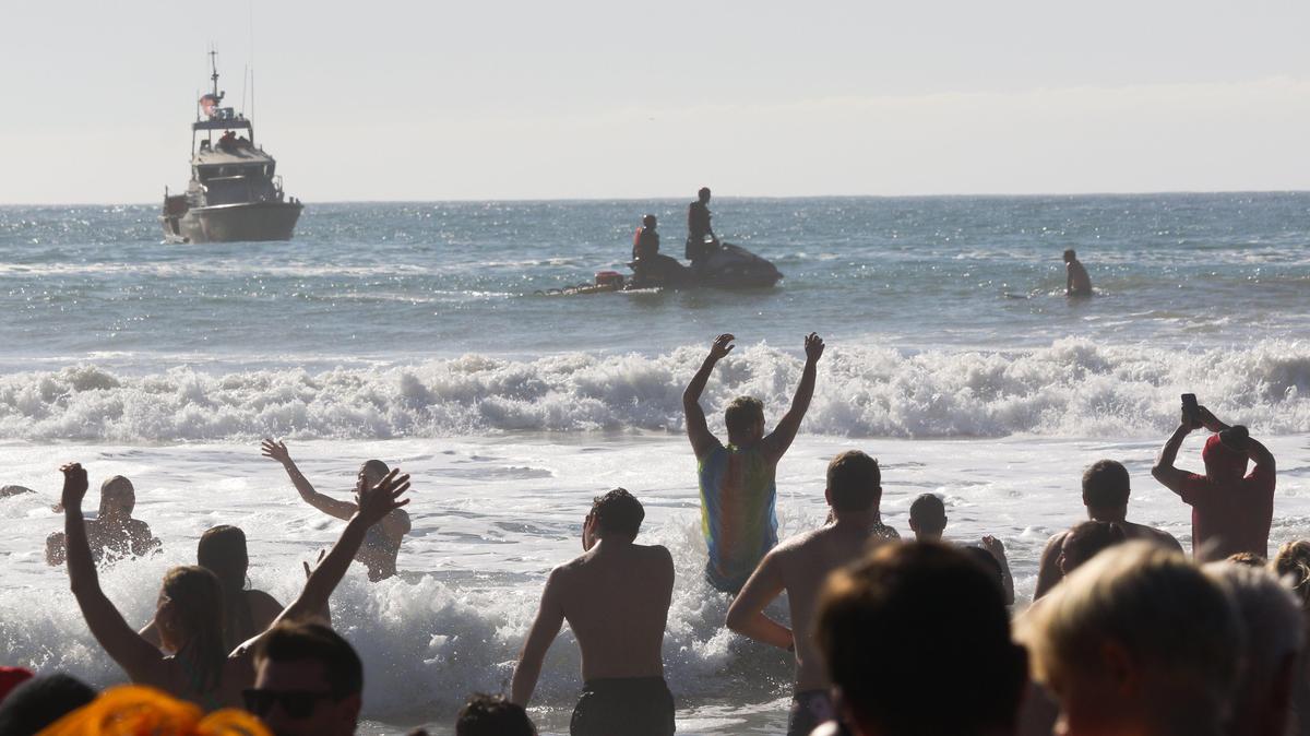 The Coast Guard and other surf rescue assistance was on hand as high waves were forecast at the 40th annual Carlin Soule Memorial Polar Bear Dip was held with swimmers in the water at noon in Cayucos Jan 1, 2020.
