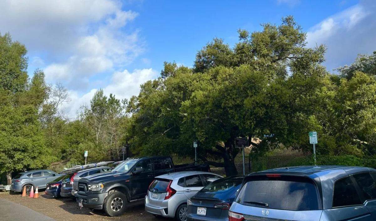The parking lot in front of the Hot Springs Trail in Montecito is packed with cars at 9 a.m. on Saturday.
