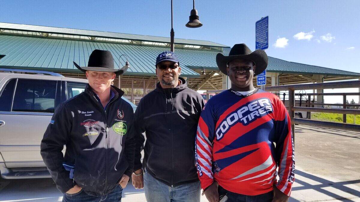 From left to right, Cal Poly Rodeo coach Ben Londo and James Ray, Sr,. and James Ray, Jr., pose for a photo.