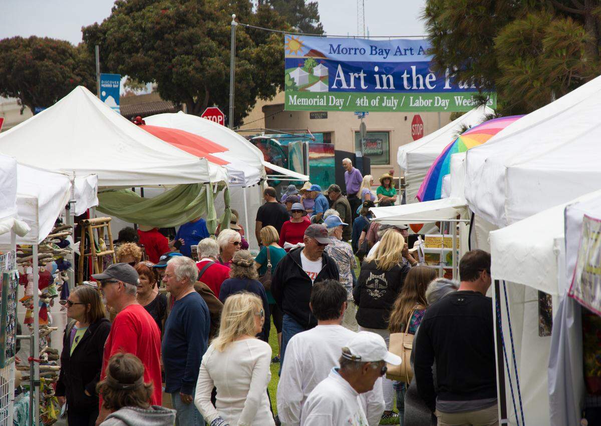 Visitors peruse arts and crafts at Morro Bay’s Art in the Park.