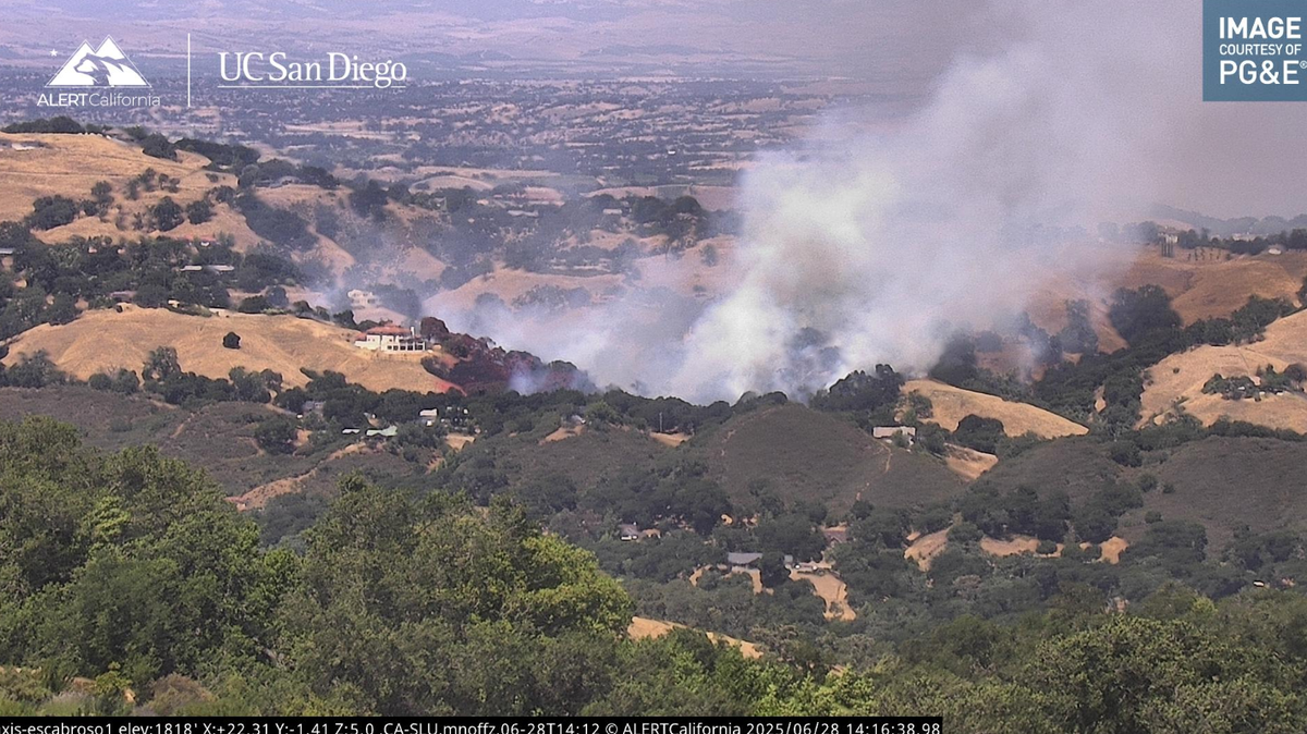 A vegetation fire burning up a hillside was threatening at least one structure near Llano Road in Atascadero on June 28, 2025.