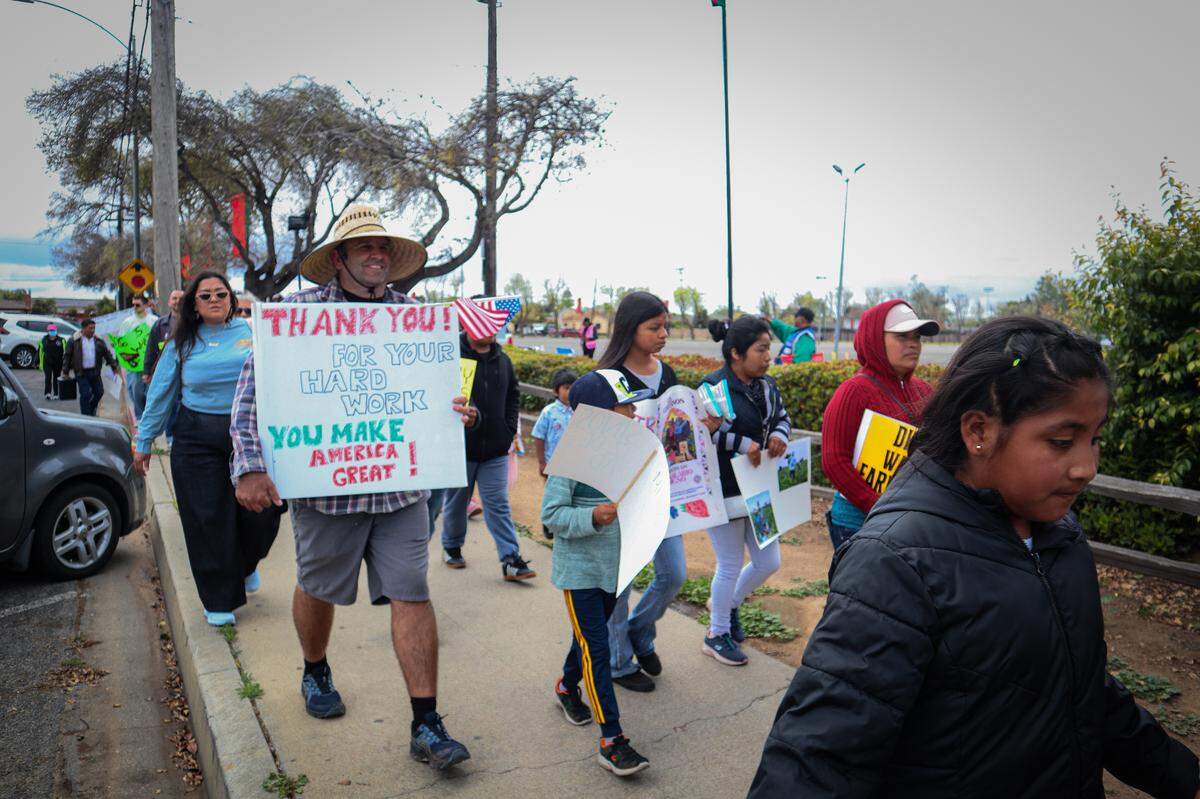 About 80 people protested the Santa Maria Strawberry Festival on April 27, 2025. They called for the Santa Barbara County Board of Supervisors to set a $26 per hour minimum wage for farmworkers.