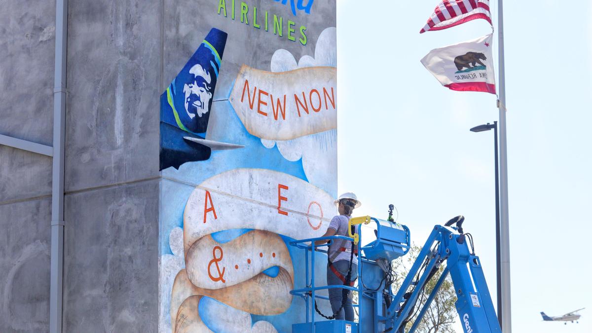 The San Luis Obispo Airport announces two new routes via Alaska Airlines to both San Diego and Portland, OR. Rachel Hamann with Dot & Cross Studio creates chalk art mural on parking lot elevator. 9-4-2019 David Middlecamp