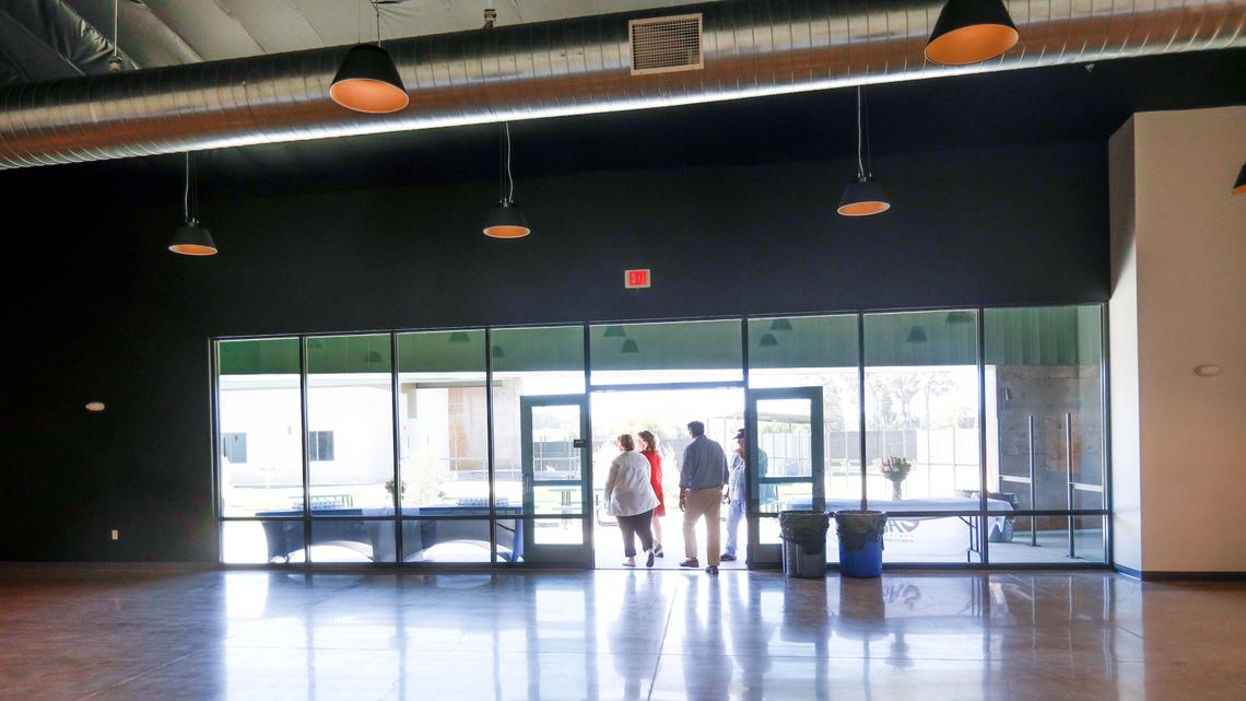 Visitors tour the dining room Monday at the 40 Prado Homeless Services Center in San Luis Obispo at its opening in 2018.