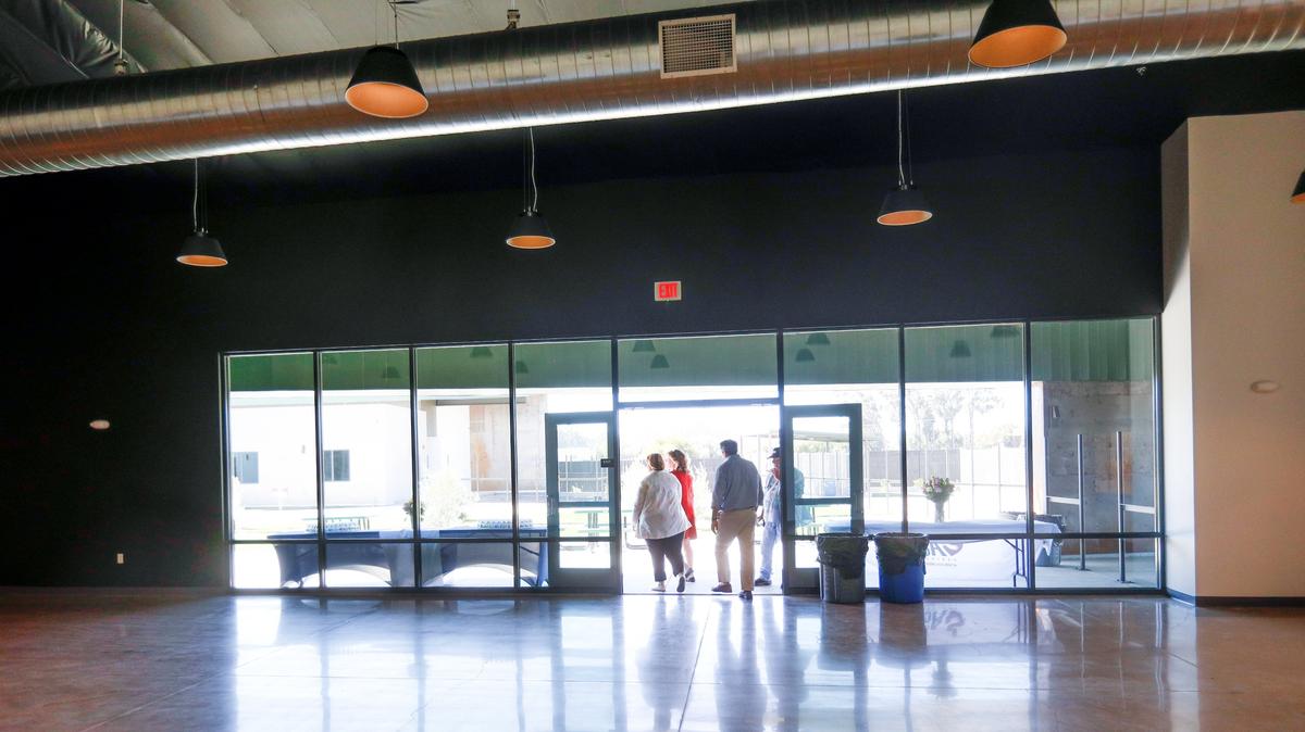 Visitors tour the dining room Monday at the 40 Prado Homeless Services Center in San Luis Obispo.
