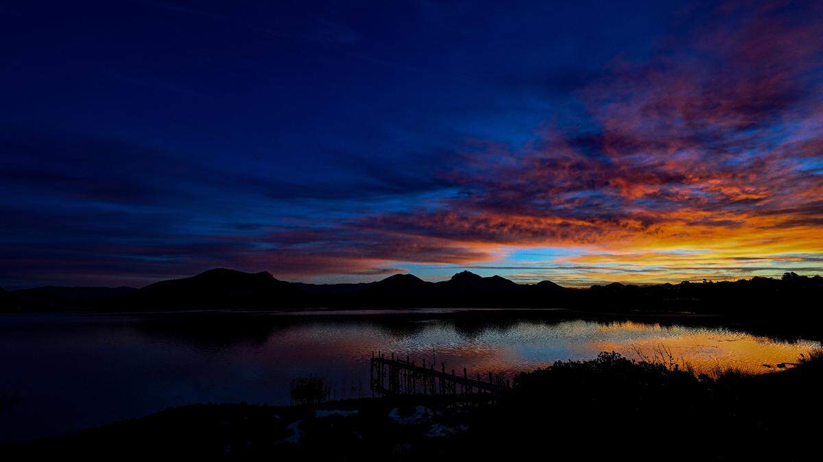 A sunrise lights up the sky near Baywood Park. 