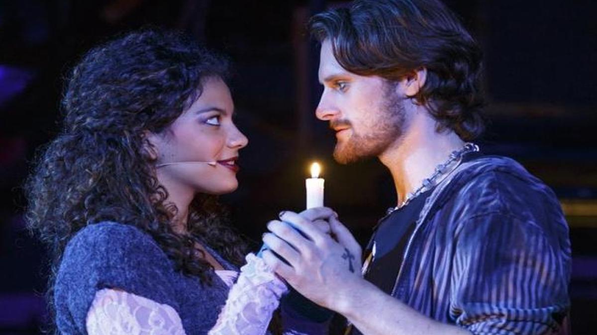 Mimi (Skyler Volpe) and Roger (Kaleb Wells) meet in “Rent.” The musical takes the stage Tuesday at the Performing Arts Center in San Luis Obispo.