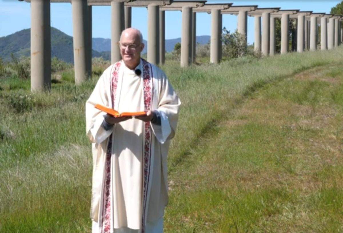 For seven weeks after Easter 2021, the Rev. Mark Stetz held pandemic mass in a different outdoor location each Sunday. The services were broadcast via YouTube on the website of Santa Rosa Catholic Church. Consuelo Macedo’s screenshot is of the pastor’s sixth-week service by the Pergola at Hearst Castle. Rev. Stetz died Sunday, March 13.