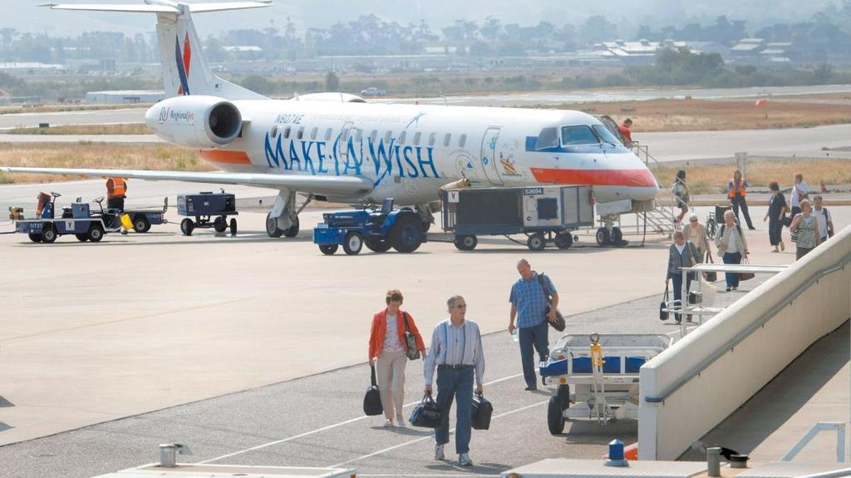 Passengers disembark an American Eagle plane in San Luis Obispo.