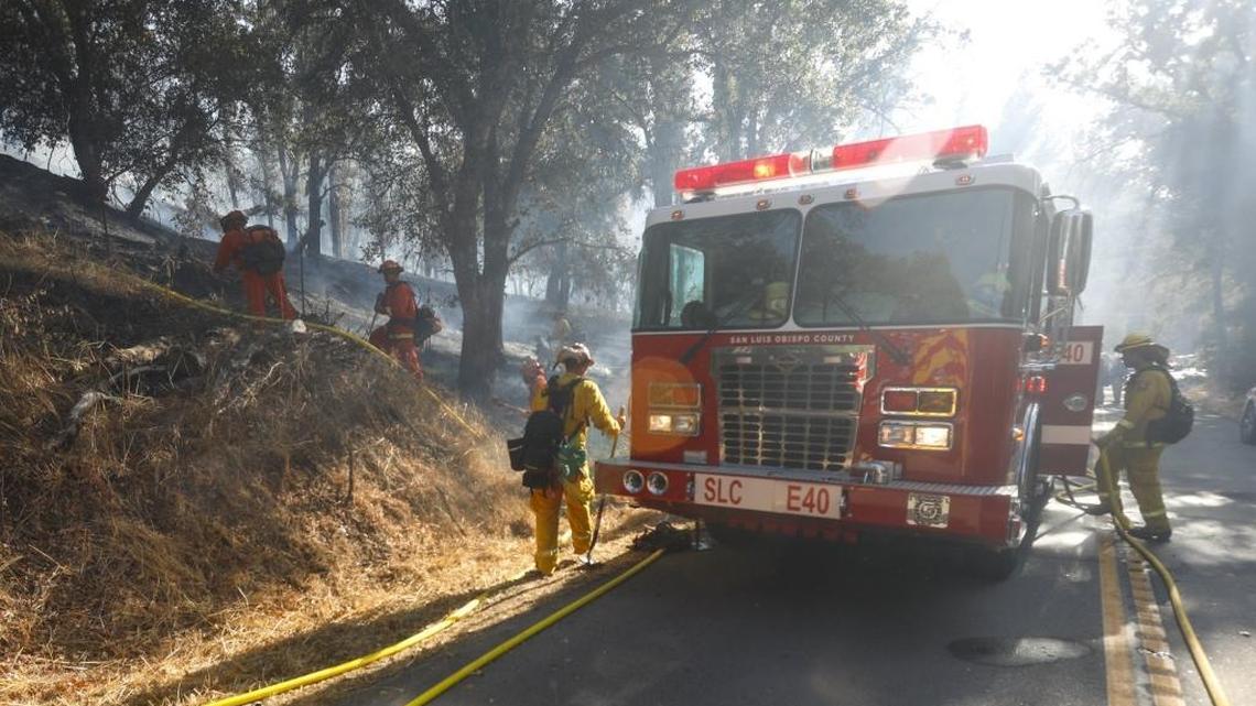 Firefighters fight a brush fire off Pozo Road on Monday, Oct. 9, 2017.