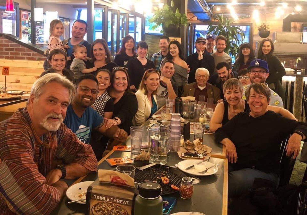Dave Romero (seated at far end of table).
