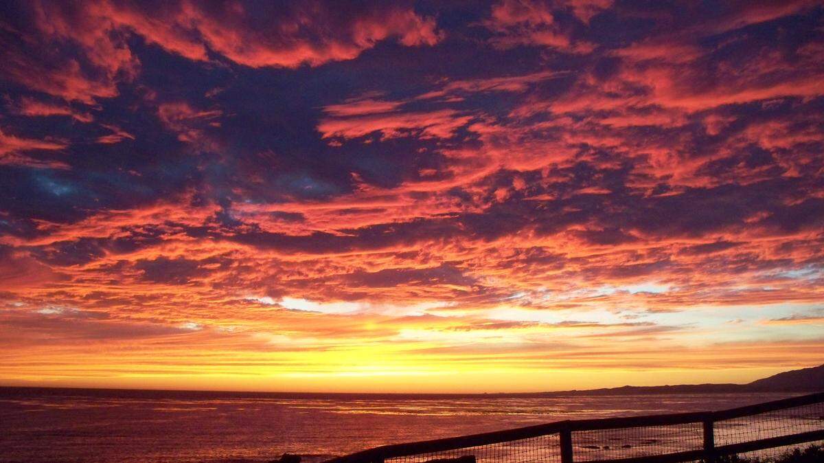 Watching a spectacular sunset like this one off a Cambria shoreline, and immersing yourself in the experience until the last rays fade away, can be an instant mood lifter.