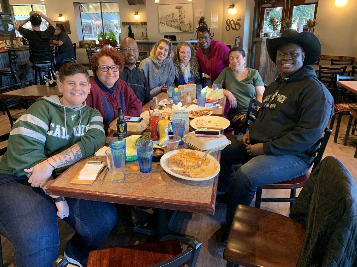 James Ray Jr. (far right) and his family on a visit to San Luis Obispo. His teacher, Briana Kramer, is pictured (far left) in a green Cal Poly sweater.