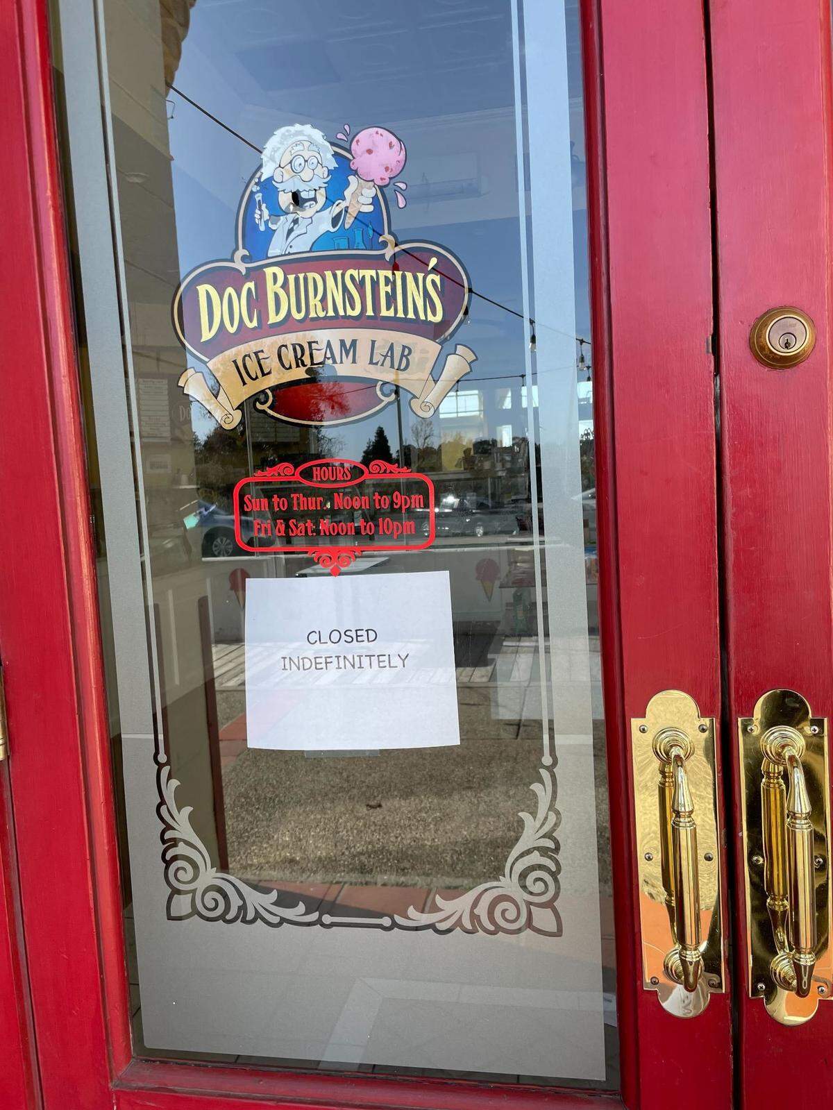 A sign in the window of the Arroyo Grande Doc Burnstein’s Ice Cream Lab said the parlor was “closed indefinitely.”