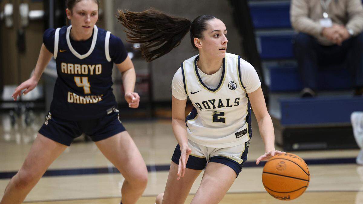 Makanani Guy dribbles with Molly Sloan in background. Mission Prep girl’s basketball team beat Arroyo Grande High school, 55-51 on Feb. 11, 2025.