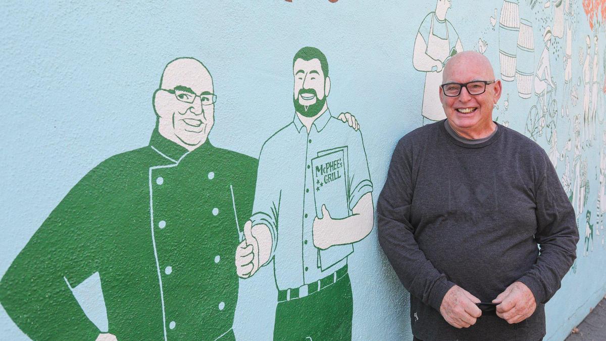 Ian McPhee stands next to a mural that features his son, Max, who is managing McPhee’s Canteen, a new casual dining location in Tin City. McPhee is also reopening the original McPhee’s Grill fine dining location in downtown Templeton after a hiatus caused by the coronavirus pandemic.