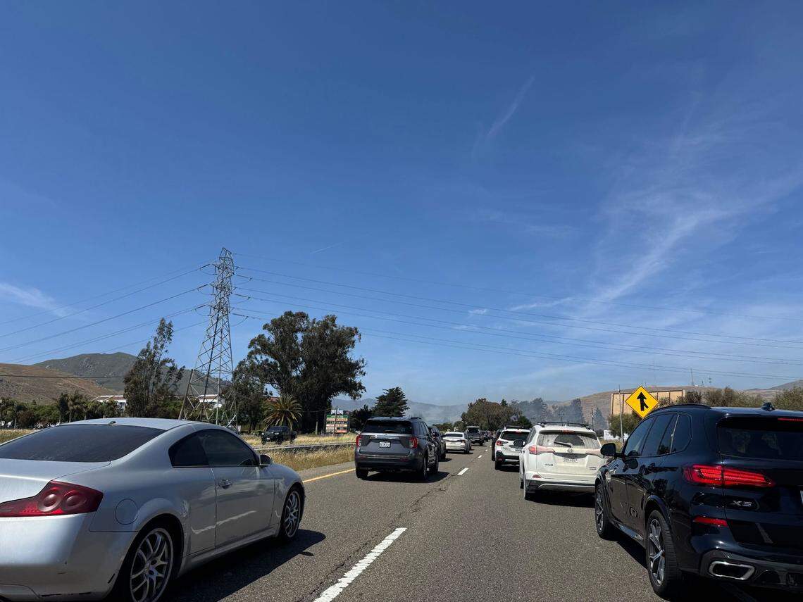 A fire broke out along Highway 101 near Madonna Road following a reported car crash on May 15, 2025.