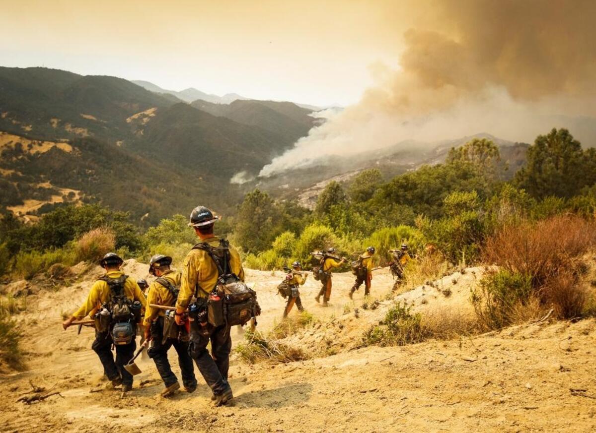 An Orange County fire crew heads out for a fire operation to remove vegetation from the progressing Chimney Fire.