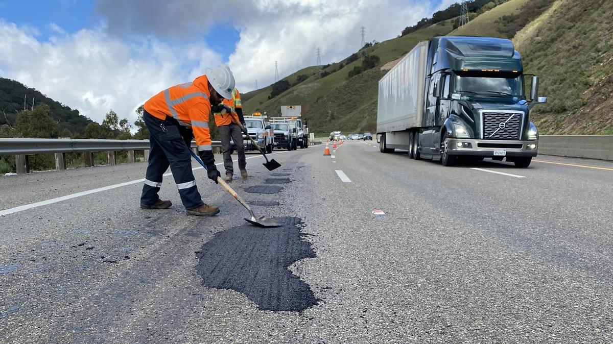 Caltrans staff fill potholes on the Cuesta Grade in San Luis Obispo County.
