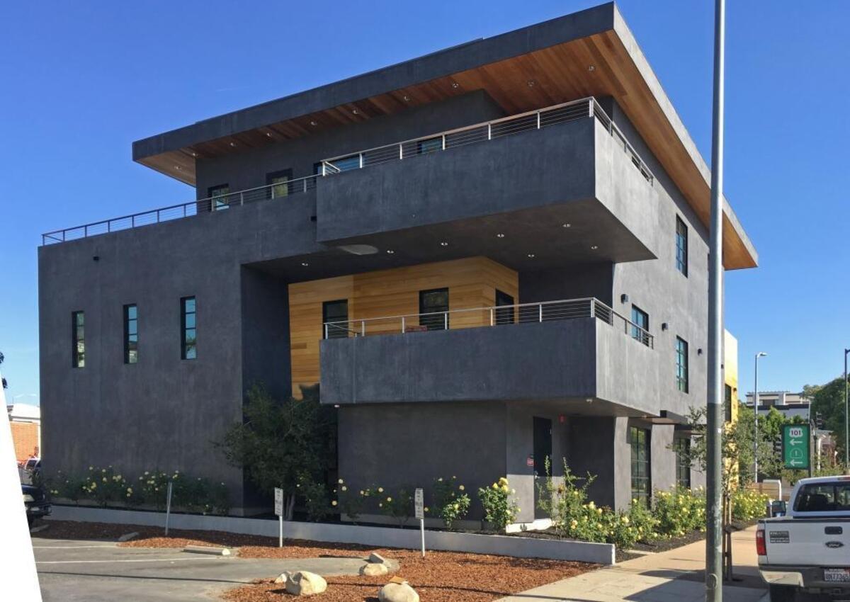 A rendering shows how an accent of wood siding would be used to break up the gray base color of the building at 1135 Santa Rosa St. in San Luis Obispo.