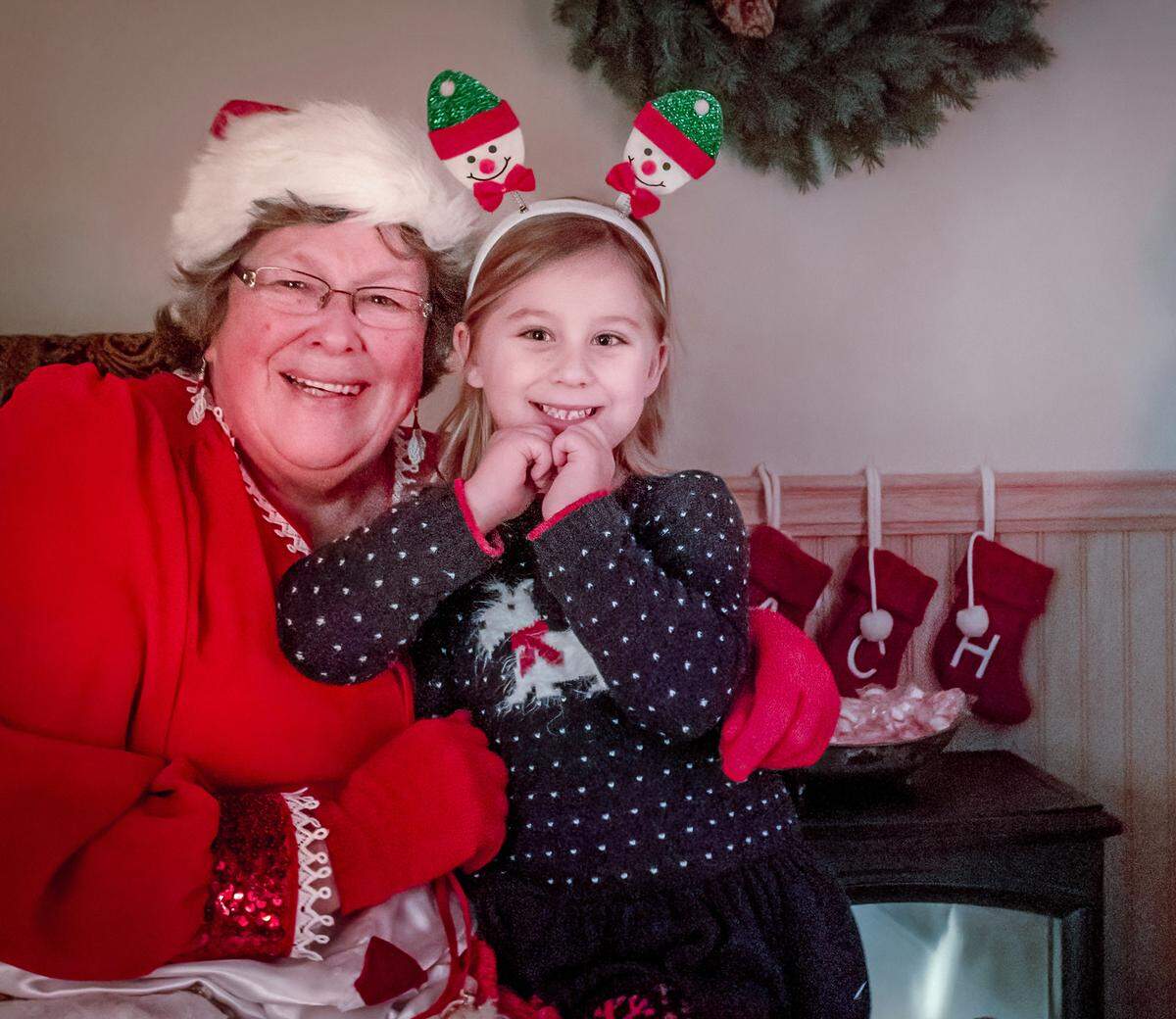 In the Cayucos Santa’s House, Della Carillo strikes a pose with Piper Coy in December 2017.