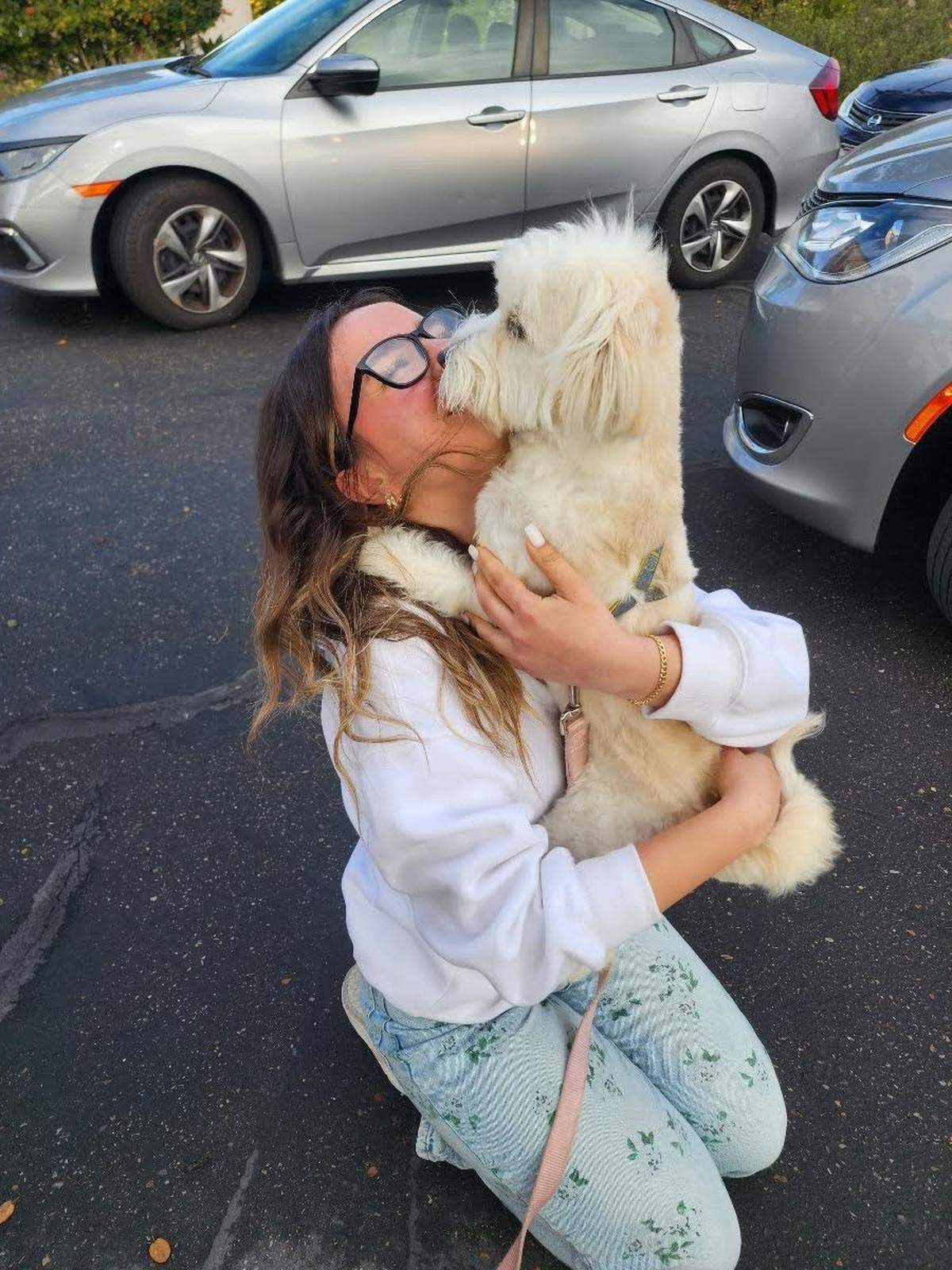 Tuti jumps into the arms of Nour Makhoul as the two are reunited in San Luis Obispo in January 2024. It was the first time Makhoul had seen her beloved pet since the two were separated when Makhoul fled Syria in April 2023.