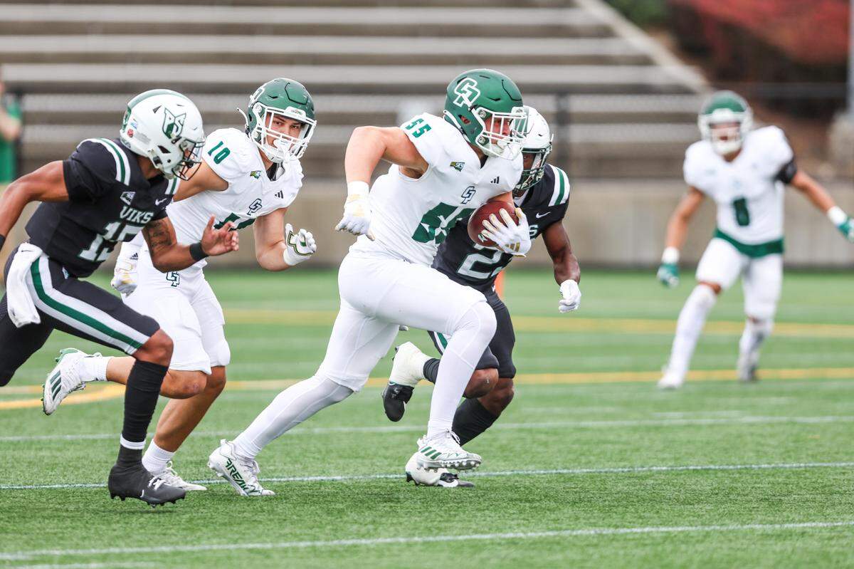 Cal Poly Mustangs defensive lineman Zachary Denis runs with the ball after recovering a fumble in the first quarter of the Mustangs’ 59-21 loss to Portland State in a Big Sky football game on Sept. 23, 2023, at Hillsboro Stadium.