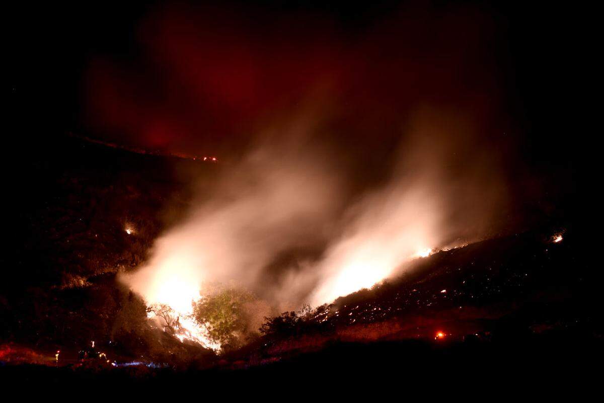 Flames from the Real Fire in El Capitán Canyon light up the terrain on the Gaviota Coast in Santa Barbara County.