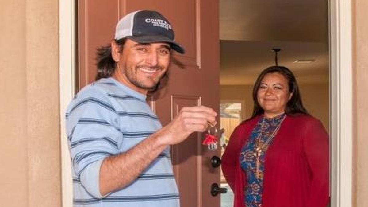 Benjamin Zavala and Esmeralda Zavala Rodriguez show off the keys to their newly constructed Atascadero home on Friday, Feb. 24, 2017. They helped to build it as part of a Peoples’ Self-Help Housing project.