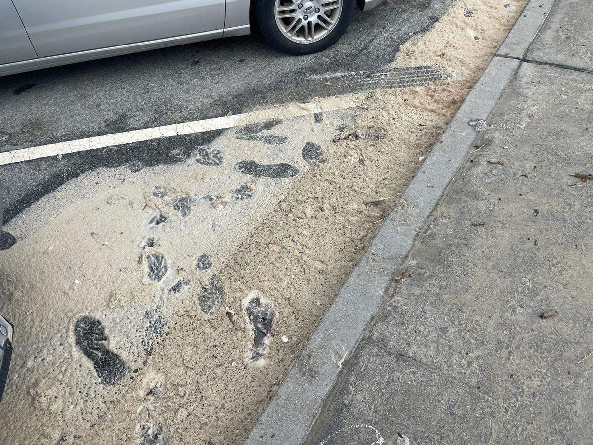 Heavy surf came up over the sidewalk in Avila Beach, leaving sea foam in the parking spaces along the street, the morning after a powerful storm hit San Luis Obispo County, on Jan. 5, 2023.
