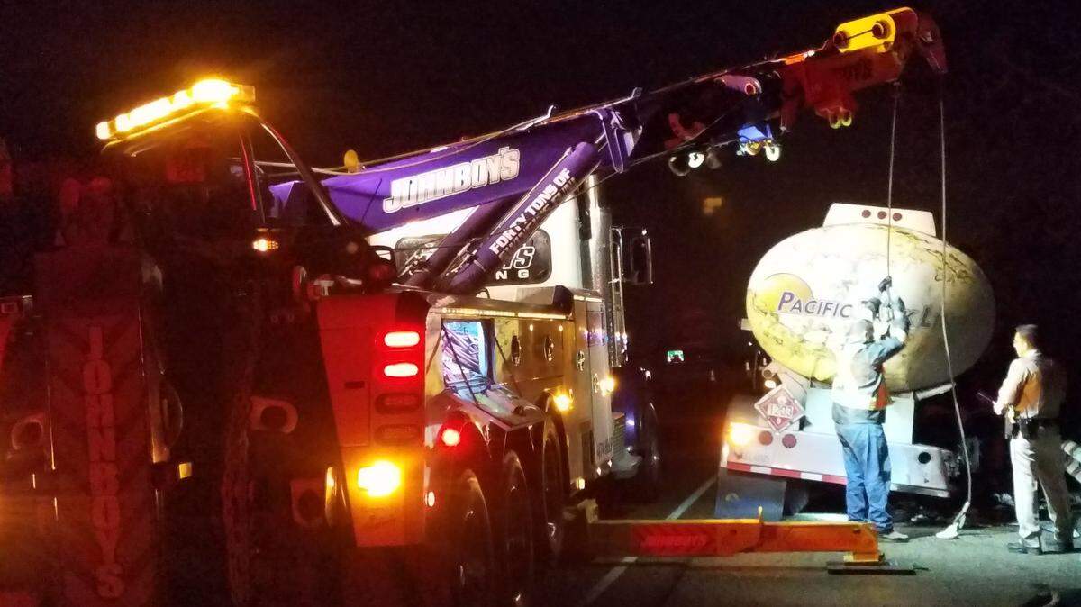 Crews work to remove a commercial vehicle that caught fire overnight Tuesday, April 3, 2018, on Highway 101 in Pismo Beach.